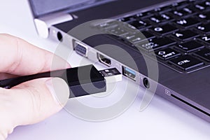 Black flash disk with laptop USB slot