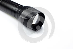 Black Flashlight on the white background. Close up
