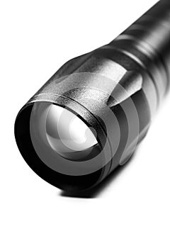 Black Flashlight on the white background. Close up