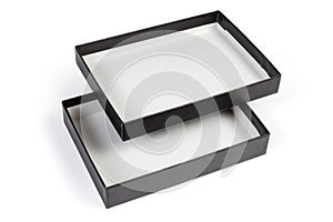 Black flat rectangular cardboard box with open inverted lid