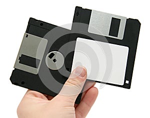 Black floppy discs in hand
