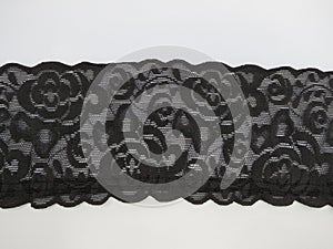 Black floral lace band background