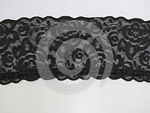 Black floral lace band background