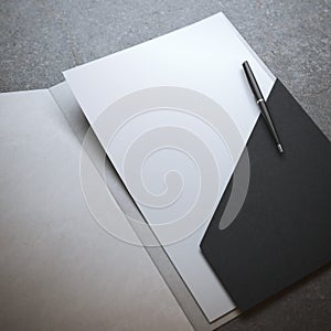 Black folder with pen