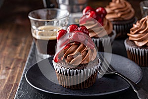 Black forest cupcake with whipped ganache and cherry topping