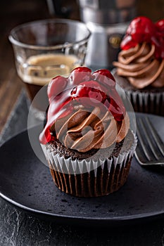 Black forest cupcake with whipped ganache and cherry topping