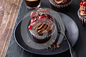 Black forest cupcake with whipped ganache and cherry topping