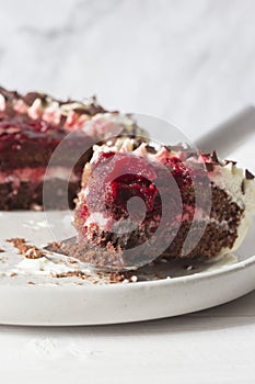 Black forest gateaux dessert on a grey stoneware plate