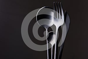 black fork, knife and spoon
