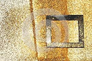 Black frame on gold glitter, background with border for your design in vintage colors