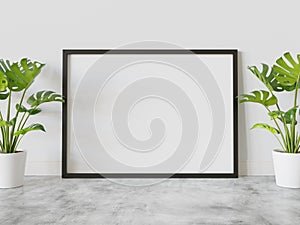 Black frame leaning on floor in interior mockup. Template of a picture framed on a wall 3D rendering