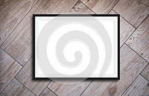 Black frame mockup on for picture or text, wooden background