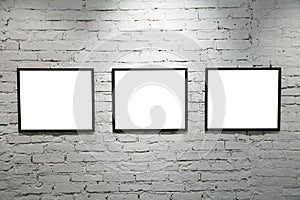 Black frames on white brick wall 2