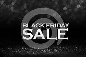 Black friday bokeh background. Elegant dark blur layout design. Silver and black glitter place on table with spotlight. Luxury