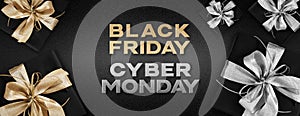 Black friday and cyber monday text write with gift packages wrapped with golden and silver ribbon bow isolated on black background