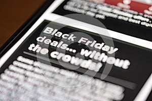 Black Friday Deals text on shopping app on smartphone screen closeup