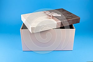 Black friday gift box with pink bow on blue background. Horizontal, banner, postcard.