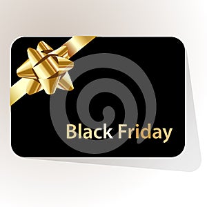 Black friday gift card black with gold bow on a white background.