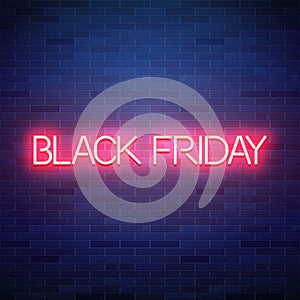 Black friday neon text on brick background, sale advertisement b