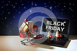 Black friday online shopping, christmas baubles and gift boxes i