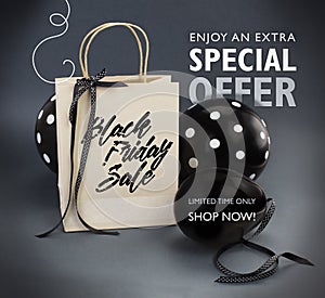 Black Friday sale banner containing recycled paper bag decorated with black satin ribbon, and black balloons.