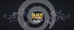 Black friday sale banner with gift boxes and snowflakes on dark black background