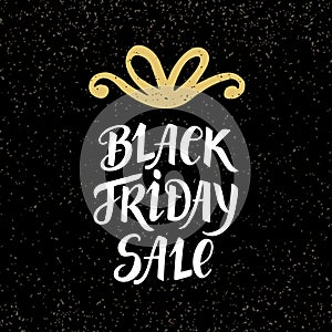 Black Friday Sale banner with hand lettering and golden bow, on dark background