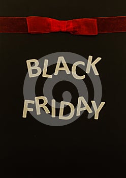 Black Friday sale banner with red bow