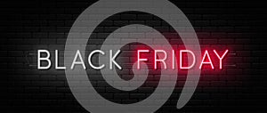 Black Friday sale. Black Friday neon sign on brick wall background. Glowing white and red neon text for advertising