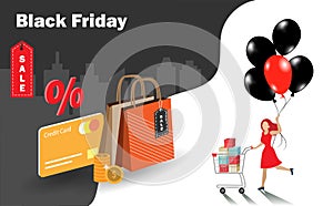 Black friday sale. Happy woman with shopping cart full of gift boxes holding black and red balloons with credit card and shopping