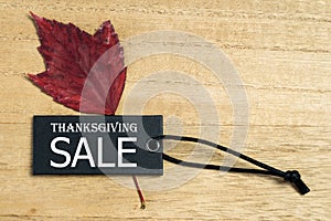 Black Friday sale label tag with autumn leaves