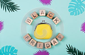 Black friday sale shopping concept alphabet on wooden blocks. Letters around the wallet. Design concept for social media