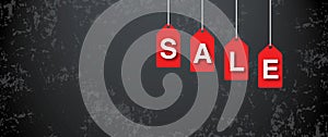 Black Friday with sale tag banner on cement or concrete dark background. Concept for Black Friday Sale.