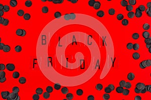 Black Friday sale tag on red background.