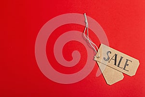 Black Friday. Sale tag on the red background. Zero waste shopping concept