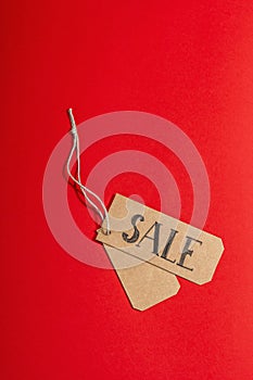Black Friday. Sale tag on the red background. Zero waste shopping concept