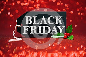 Black Friday sale tag on red glitter