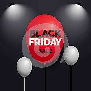 Black friday sale text on red balloon with spotlight lamp and dark background social media banner vector design