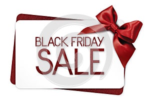 Black Friday sale text write on white gift card with red ribbon