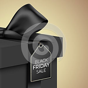 Black Friday Sale vector banner design. Premium gift box wrapped with satin ribbon, and hanging tag on golden background