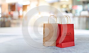 Black Friday shopping bags on floor outdoor