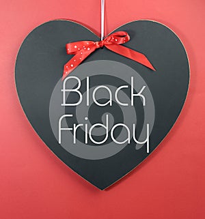 Black Friday shopping sale concept with message on a heart shape blackboard