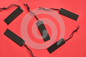 Black friday shopping tag on red background . Concept Sale. Top view