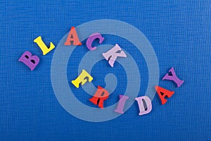 BLACK FRIDAY word on blue background composed from colorful abc alphabet block wooden letters, copy space for ad text