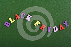 BLACK FRIDAY word on green background composed from colorful abc alphabet block wooden letters, copy space for ad text. Learning