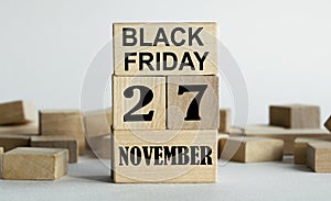 Black Friday is written on wooden cubes stacked in the form of a mobile calendar