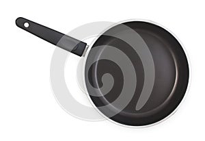 Black frying pan with nonstick surface isolated on white background, close-up, top view