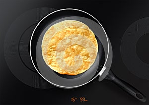 Black frying pan with pancake