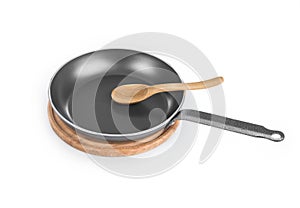 Black frying pan with wooden spoon