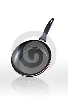 Black frypan over  on white